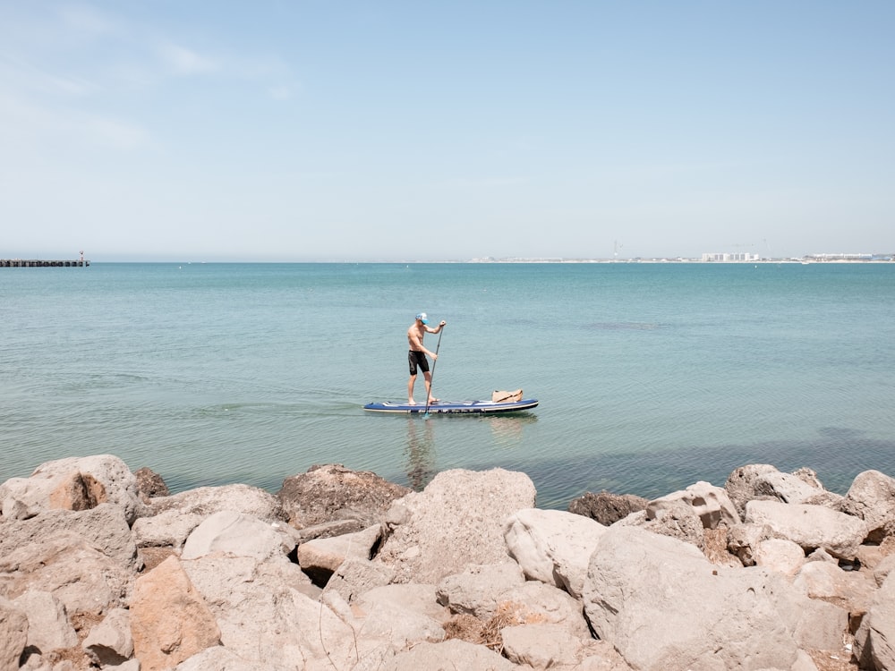 a person on a surfboard in the water