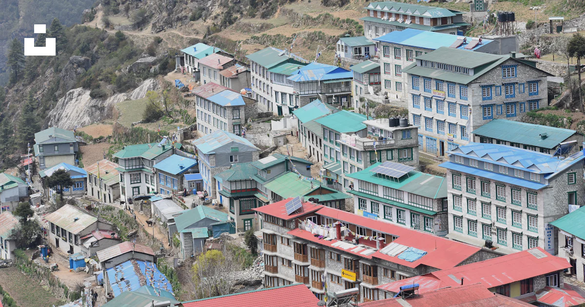 Nepl Building A group of buildings on a hill photo – Free Nepal Image on Unsplash