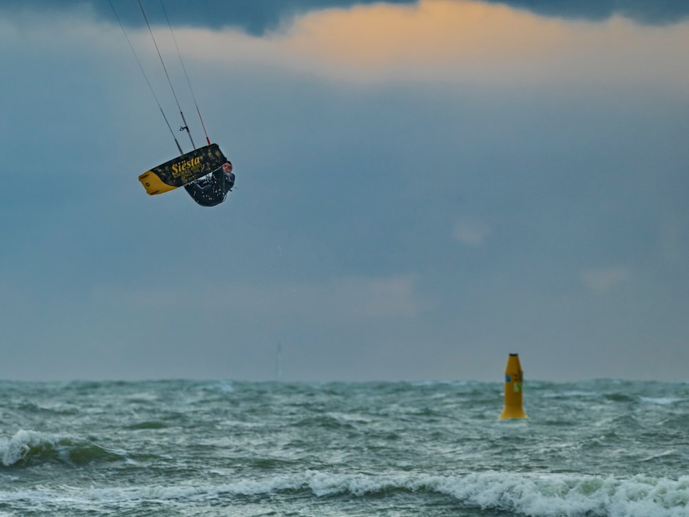 a person parasailing over the ocean