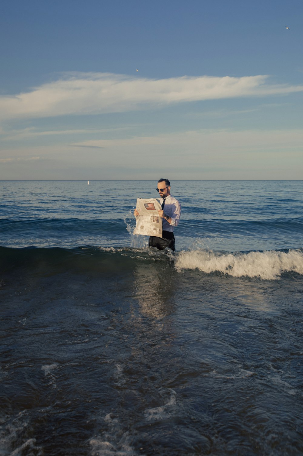 a man holding a surfboard in the ocean