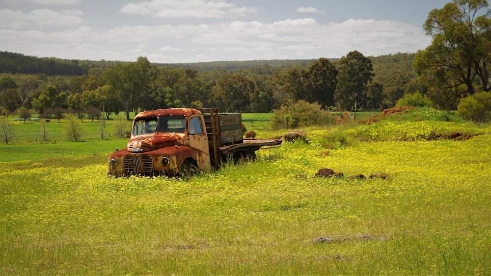 an old truck in a field