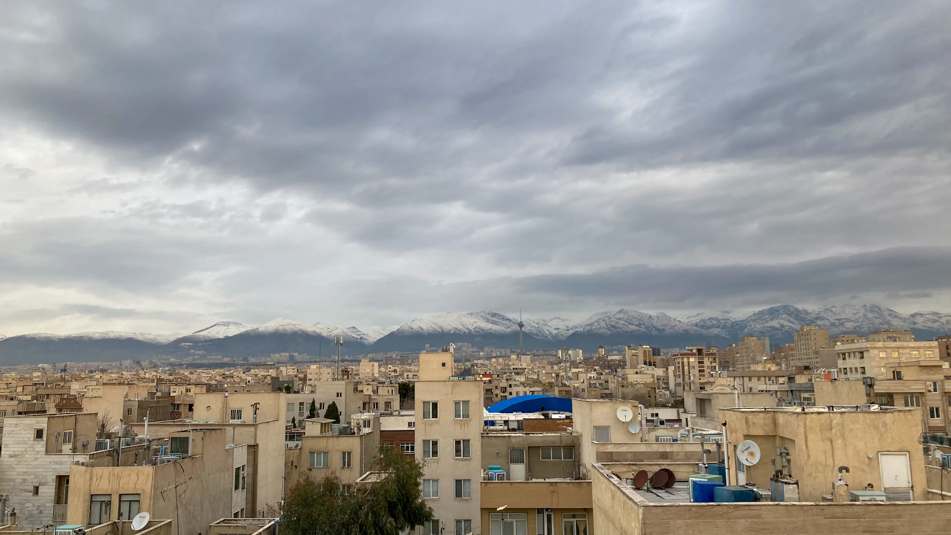 a city with mountains in the background