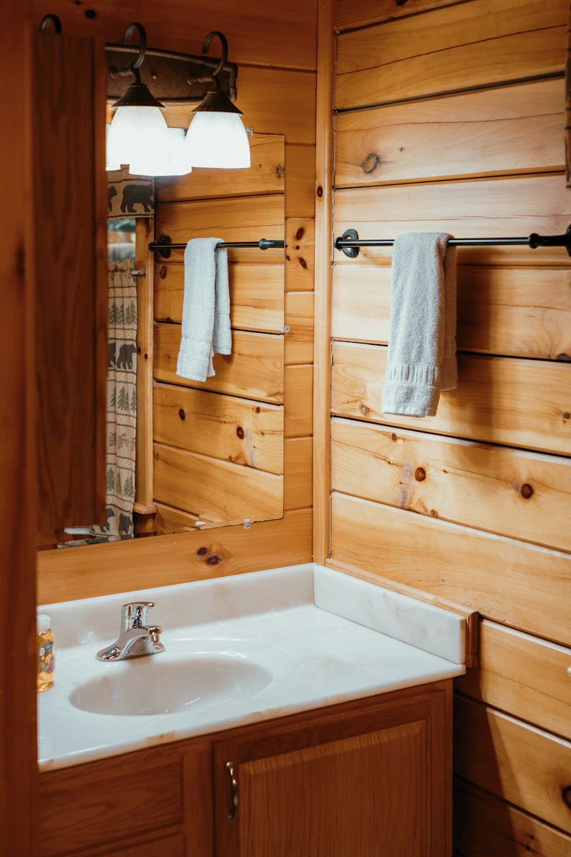 A bathroom with a mirror and a sink