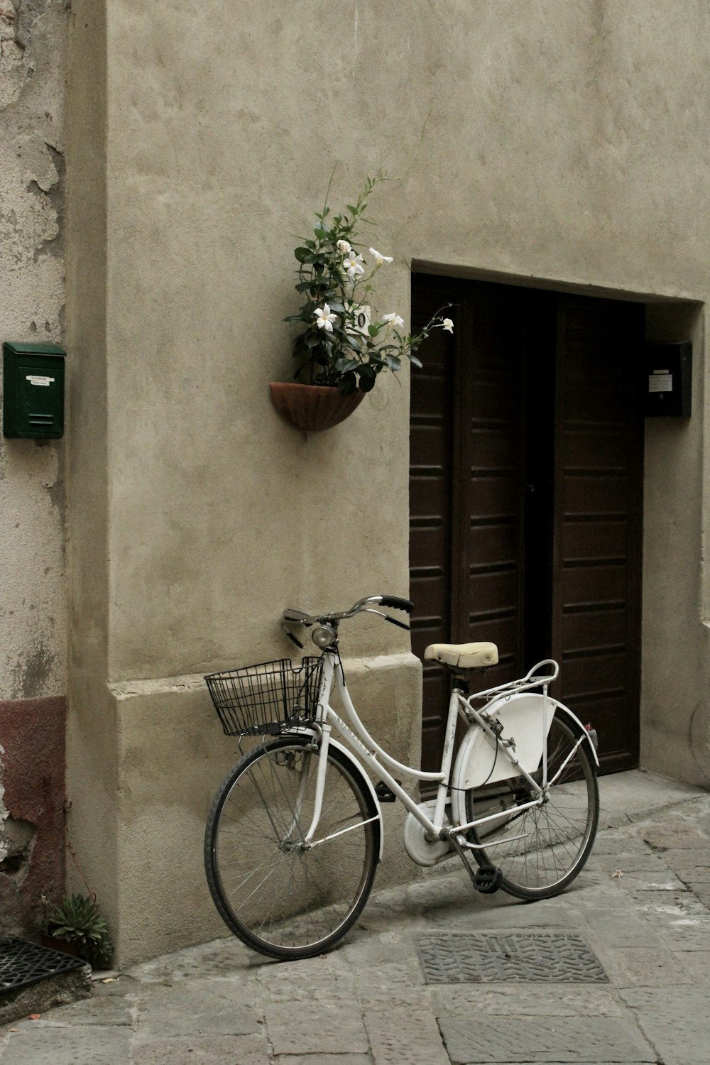 a bicycle parked in front of a door
