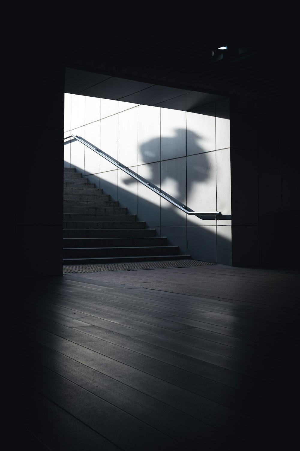 a staircase with a light on the side