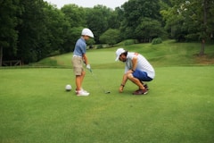 a couple of men playing golf