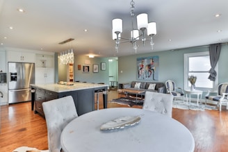 a large kitchen with a dining table