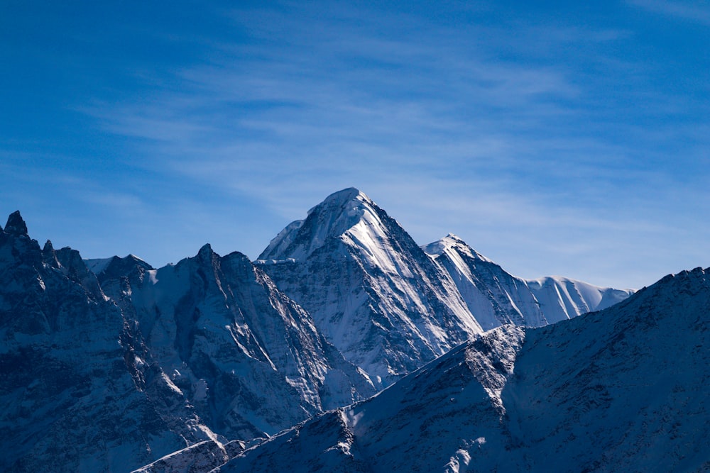 a snowy mountain range photo – Free Mountain Image on Unsplash