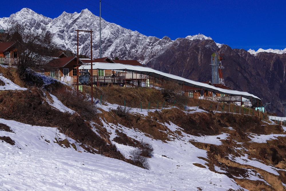 a building on a hill with snow