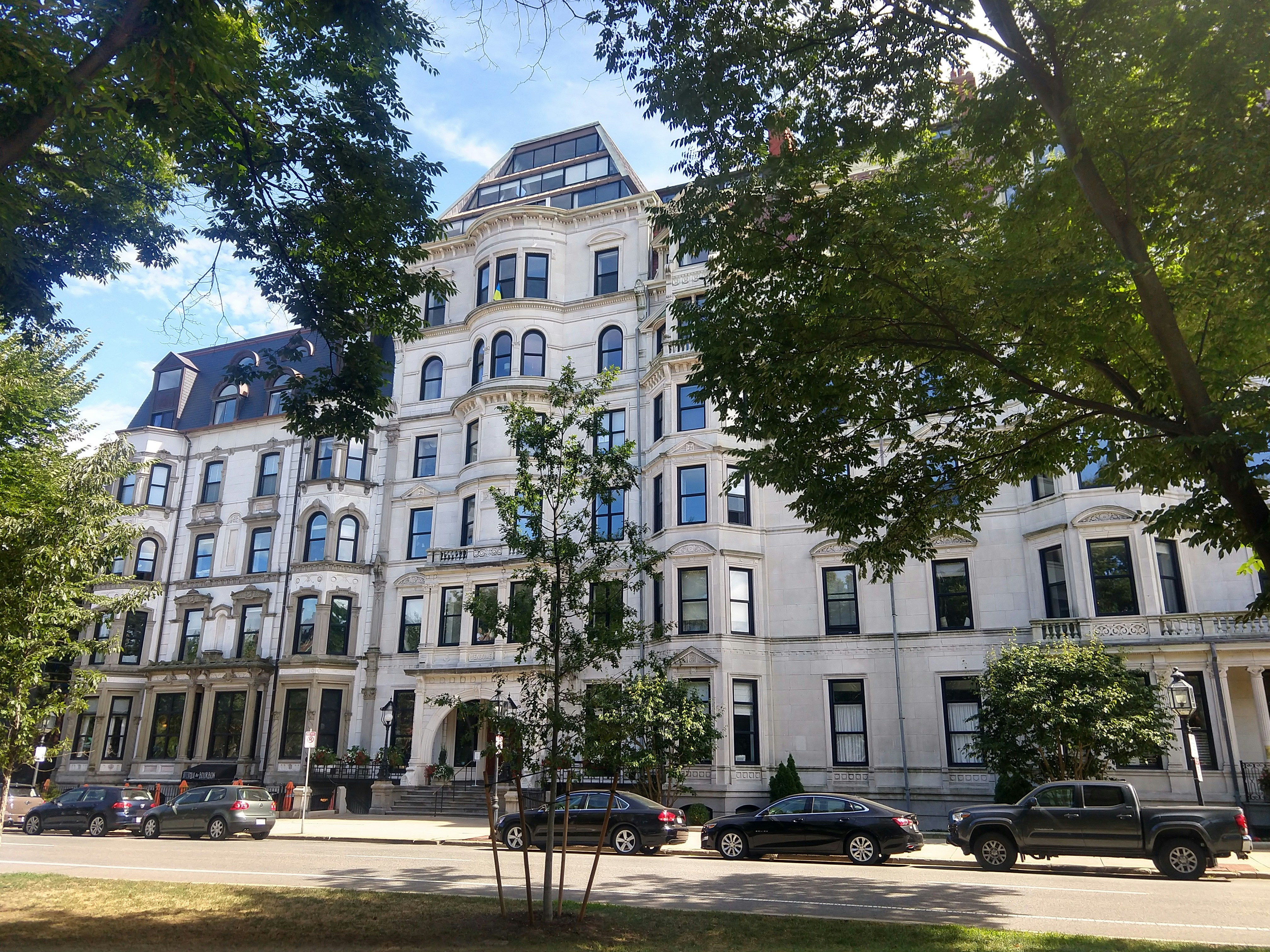 a building with cars parked in front