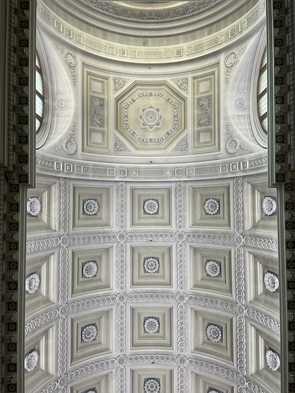 a ceiling with many intricate designs