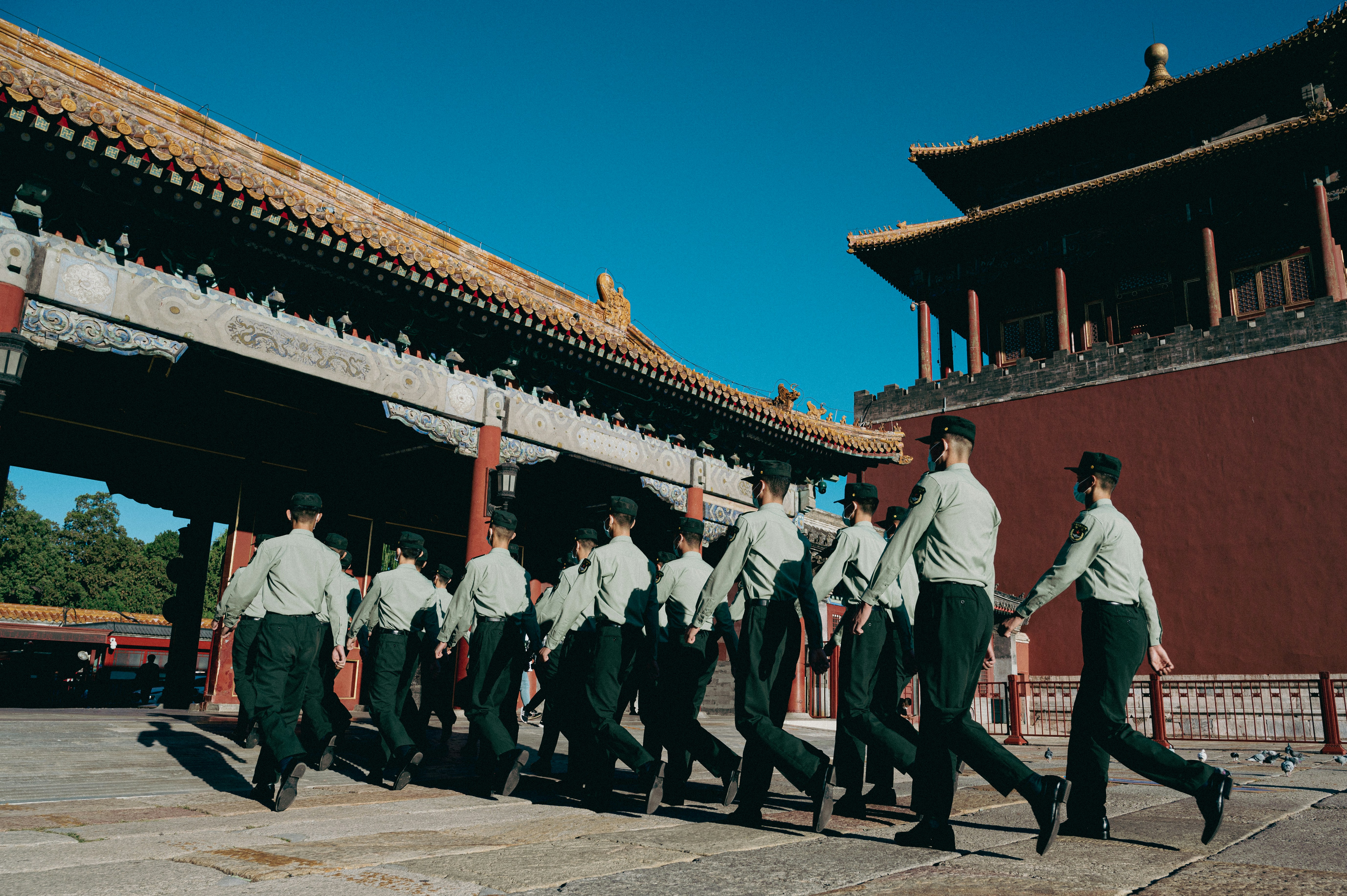 a group of men in uniform walking