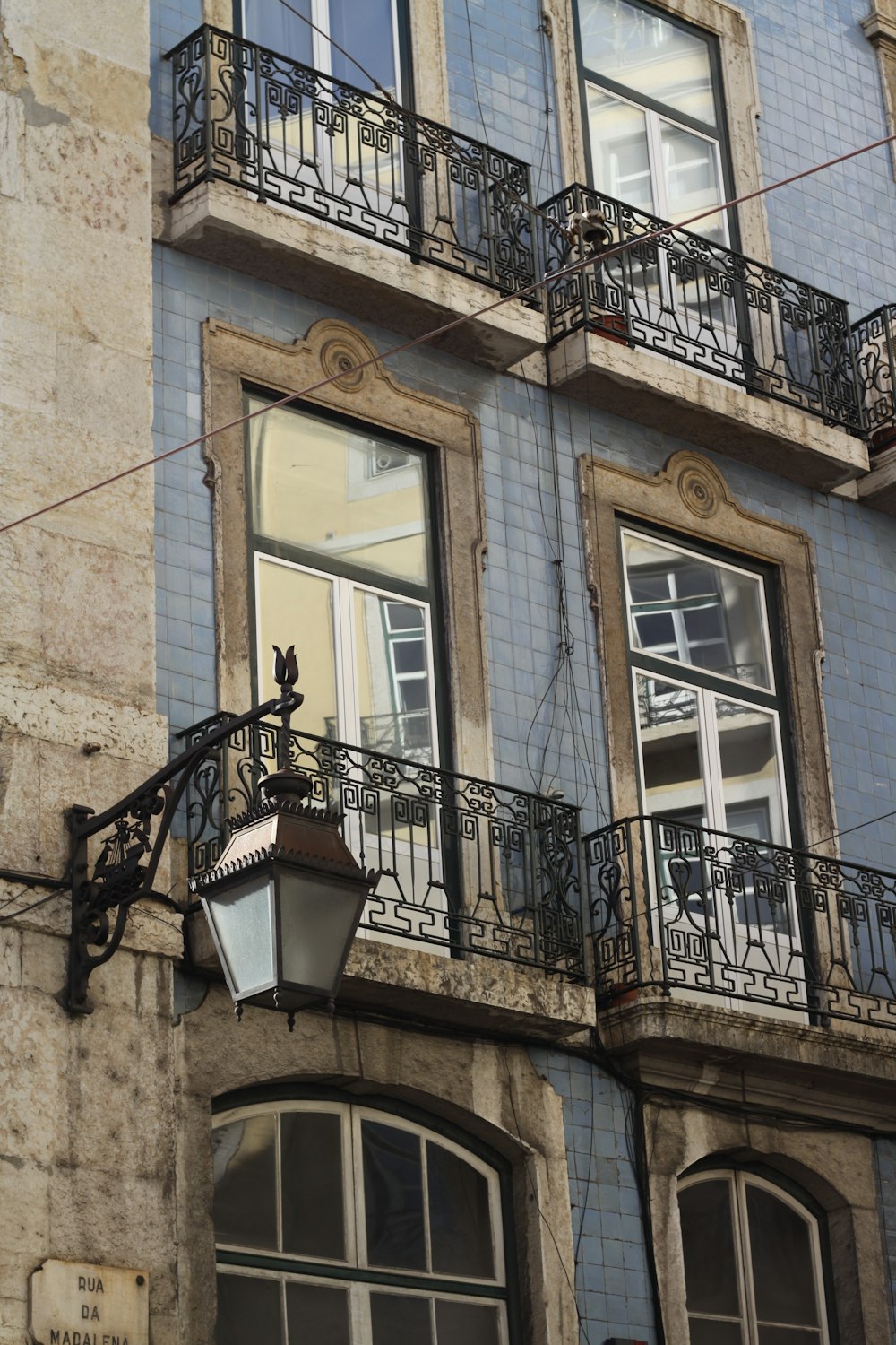 a building with windows and balconies