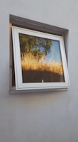 a framed painting on a wall