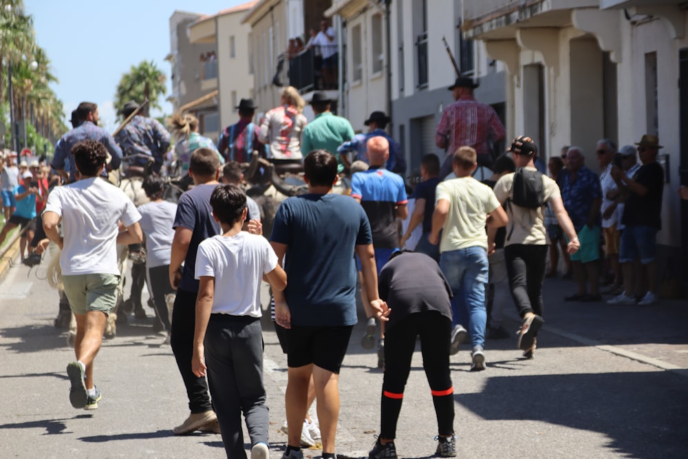 a group of people walking down a street