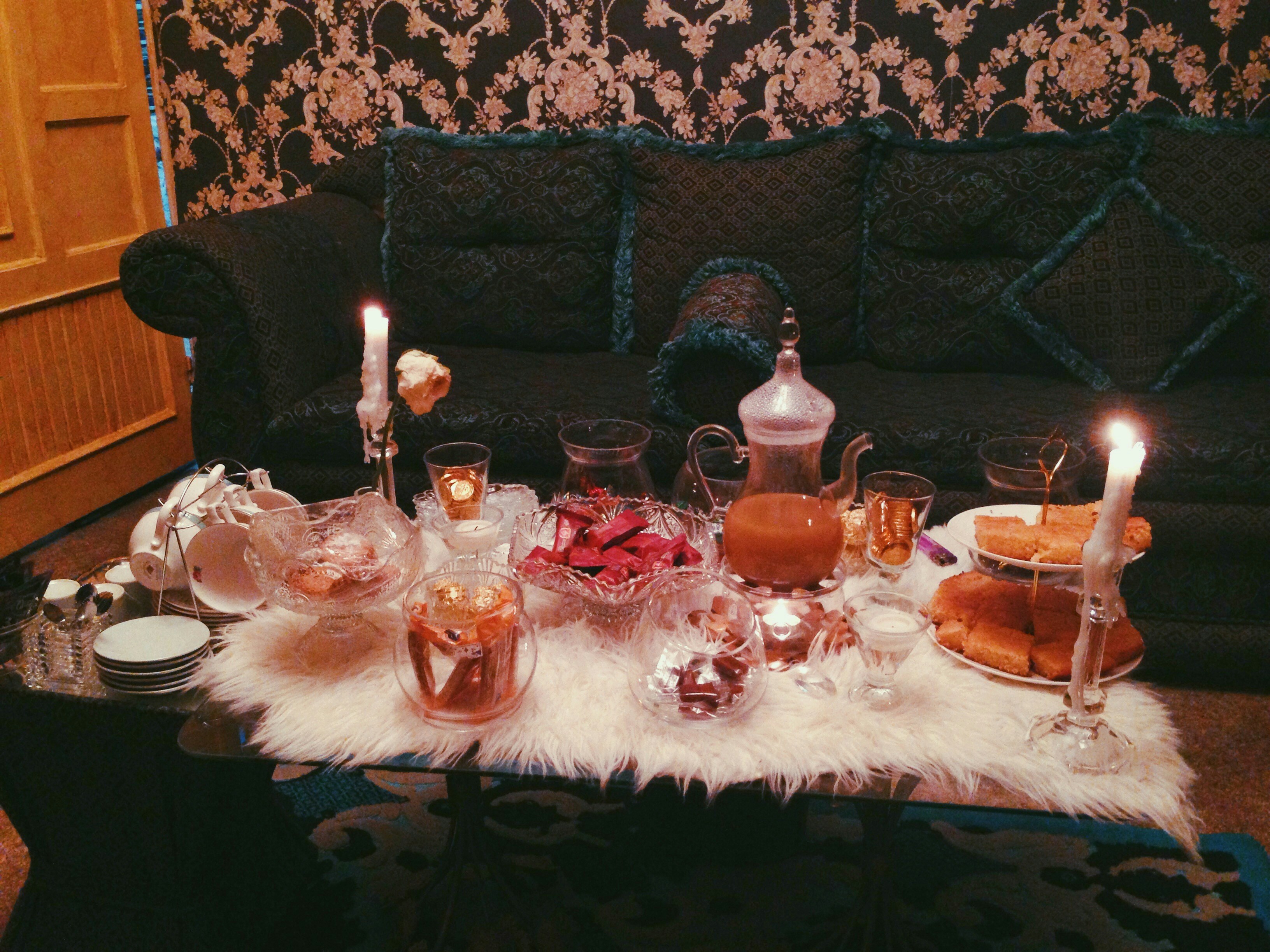 a table with candles and glasses on it