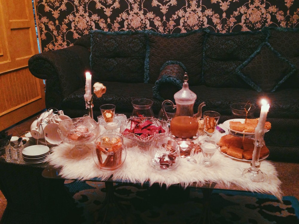 a table with candles and glasses on it