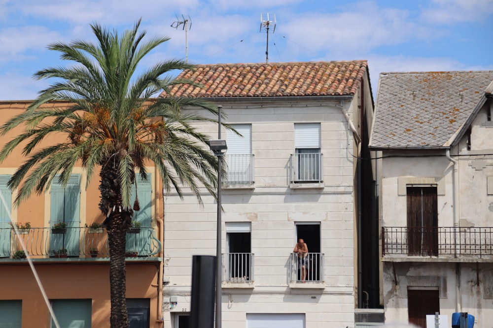 a person standing on a balcony of a house