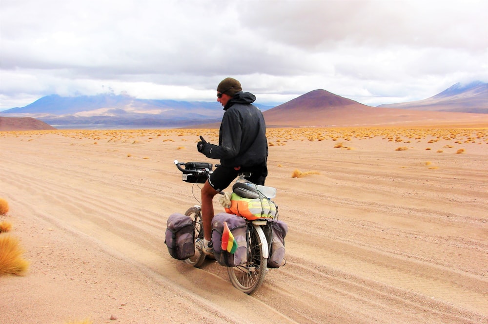 a man riding a motorcycle in the desert