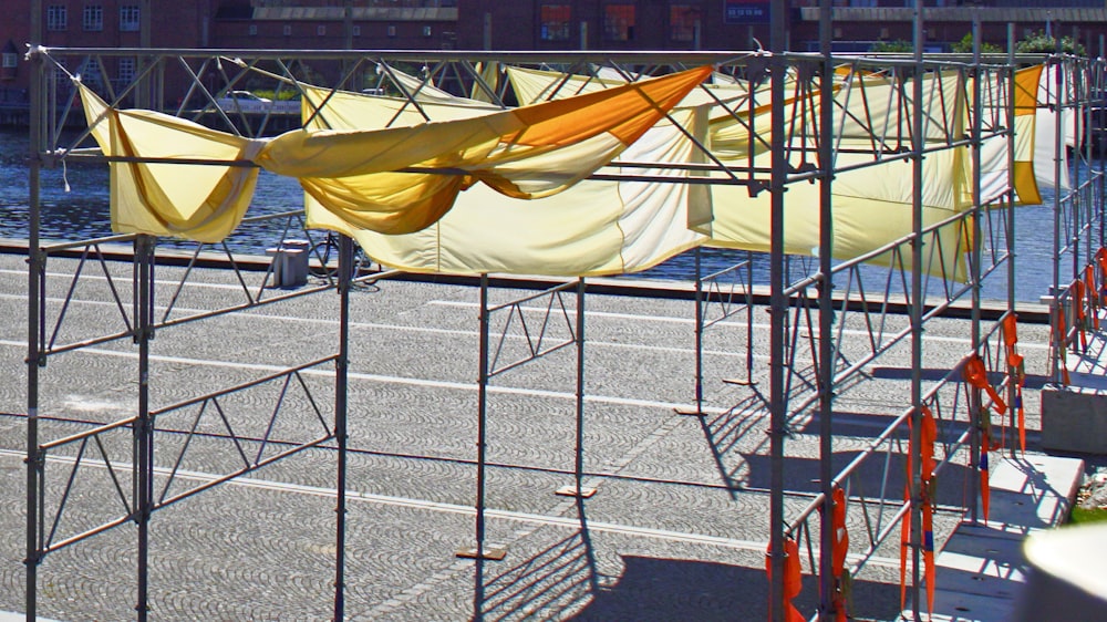 a row of yellow and white boats