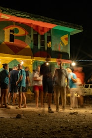 a group of people standing outside a tent
