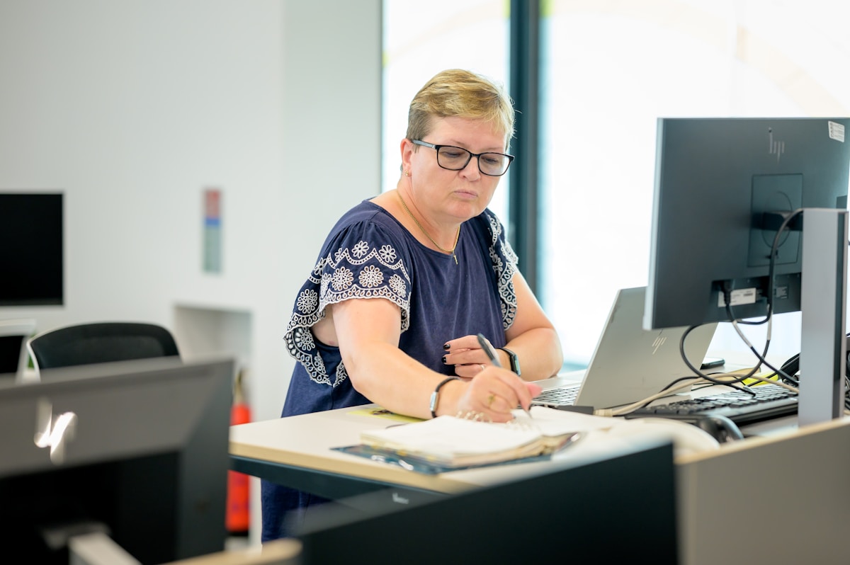 Solicitor and business owner reviewing sale heads of terms documentation