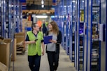 a man and a woman in a warehouse