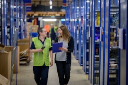 a man and a woman in a warehouse
