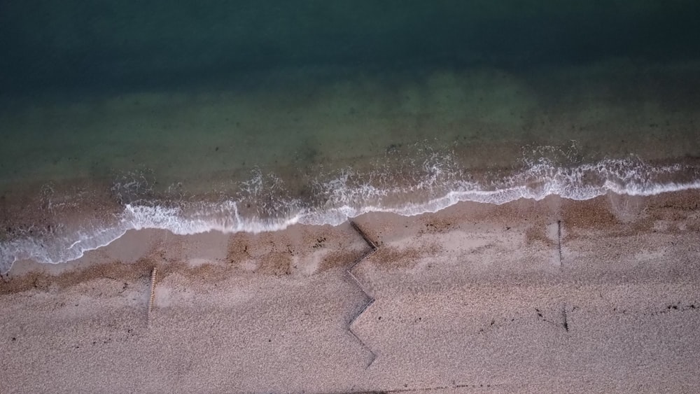 a wave crashing on a beach