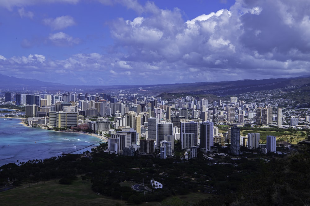 a city with a body of water in the background