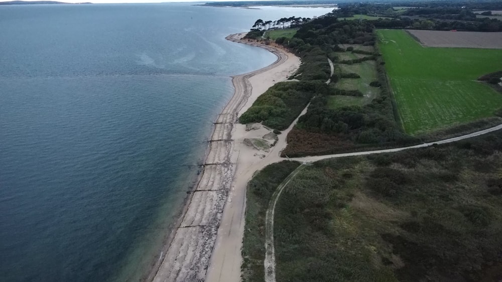 a road next to a body of water