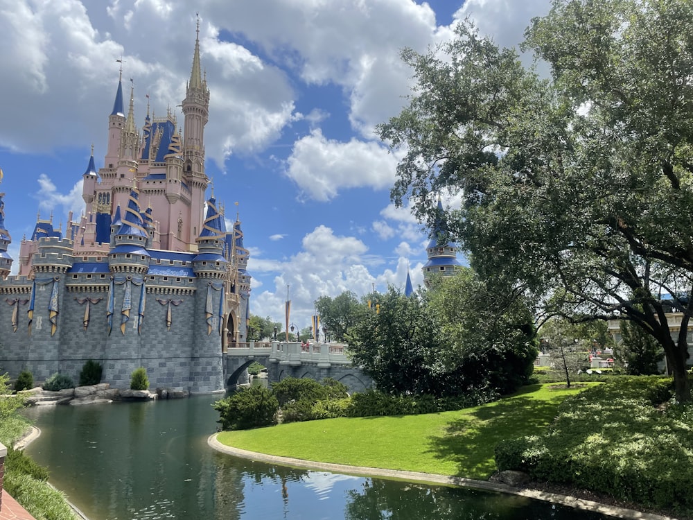 a castle with a moat and trees