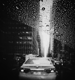 a car driving in the rain in lagos enjoying the excellent wet braking of the michelin primacy tyres 