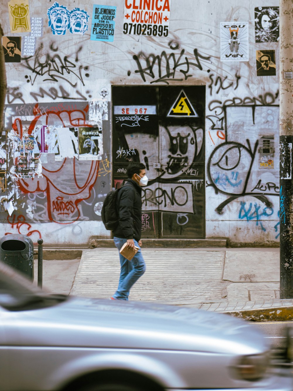 a person walking on a sidewalk