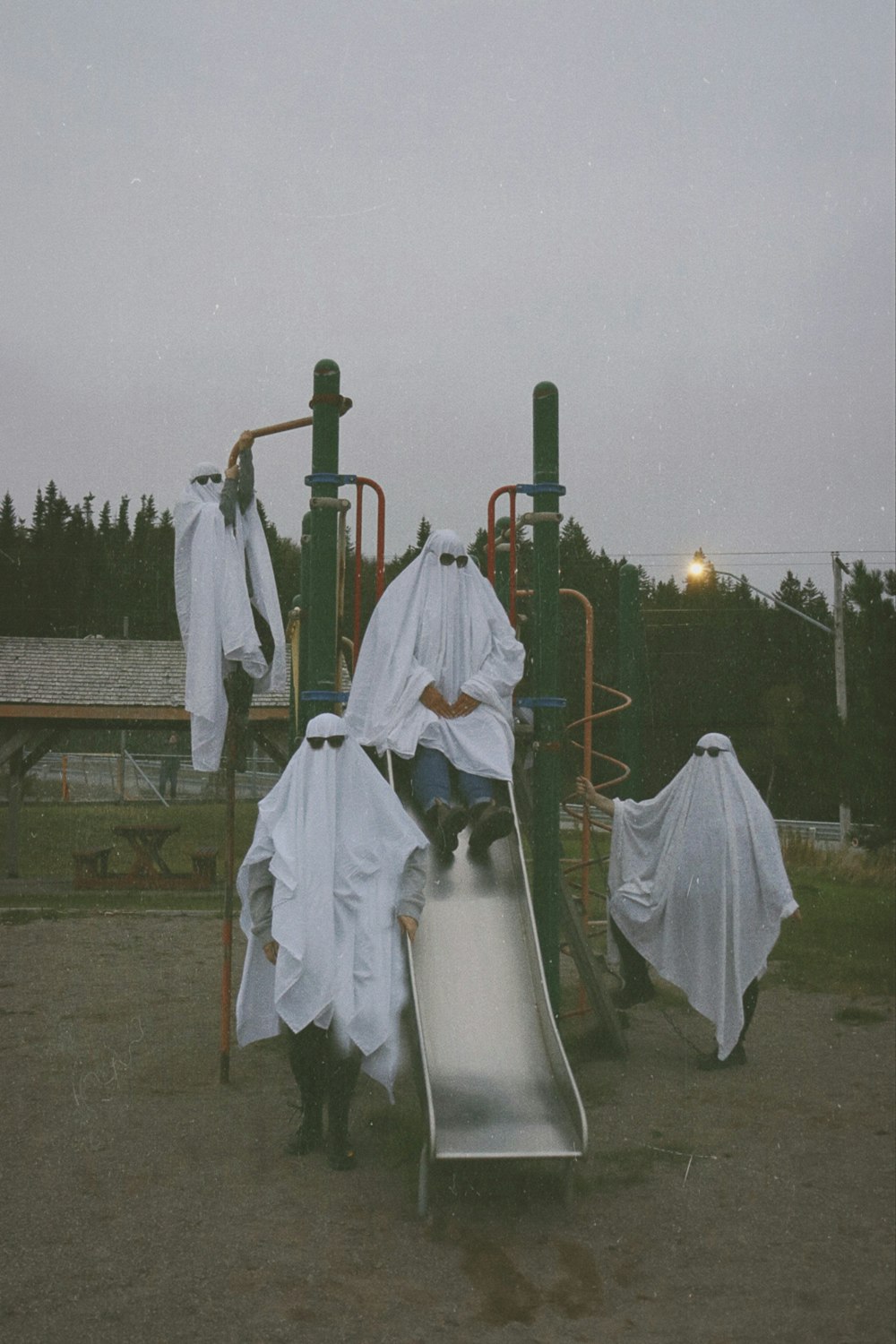 a group of people in white robes