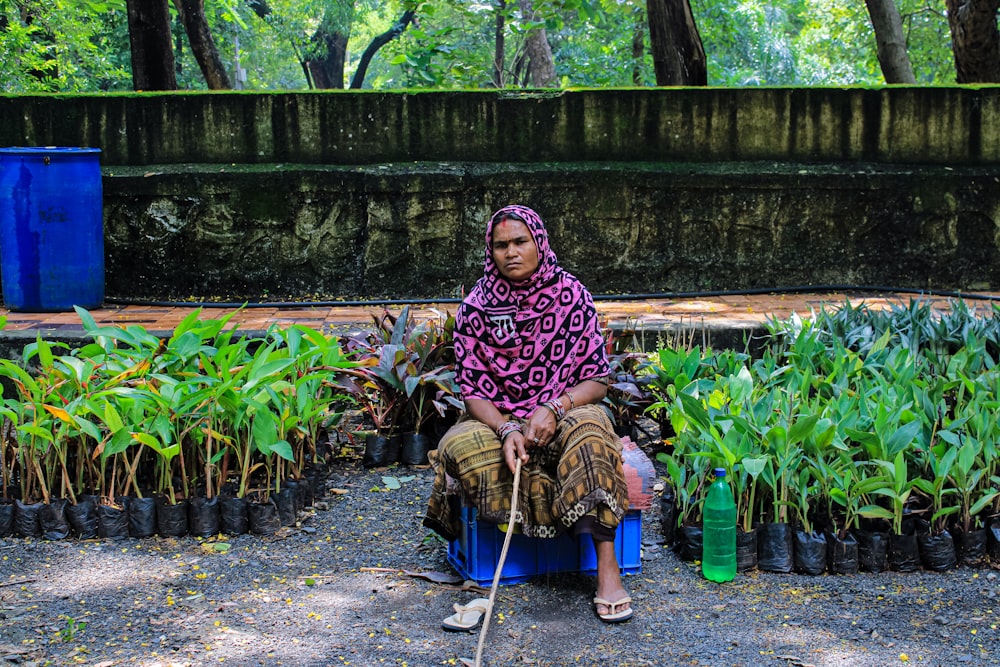 a person sitting on a chair outside