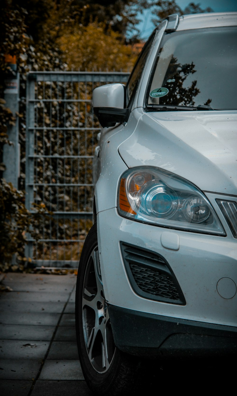 a car parked in front of a gate