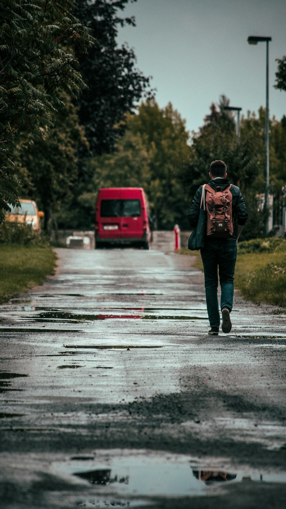 a person walking on a wet road