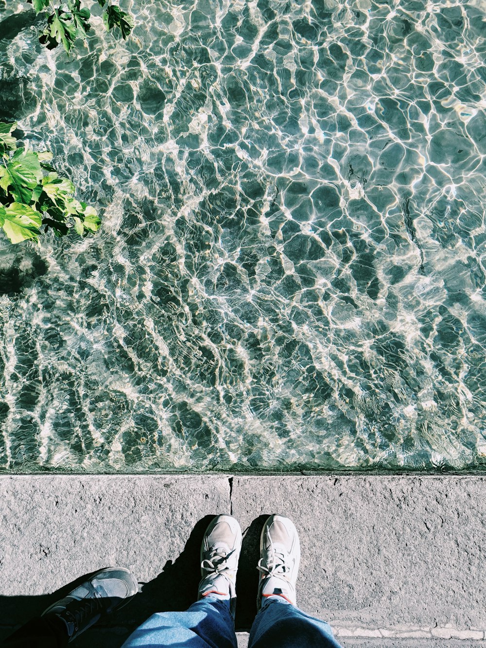 a group of people's feet on a stone surface