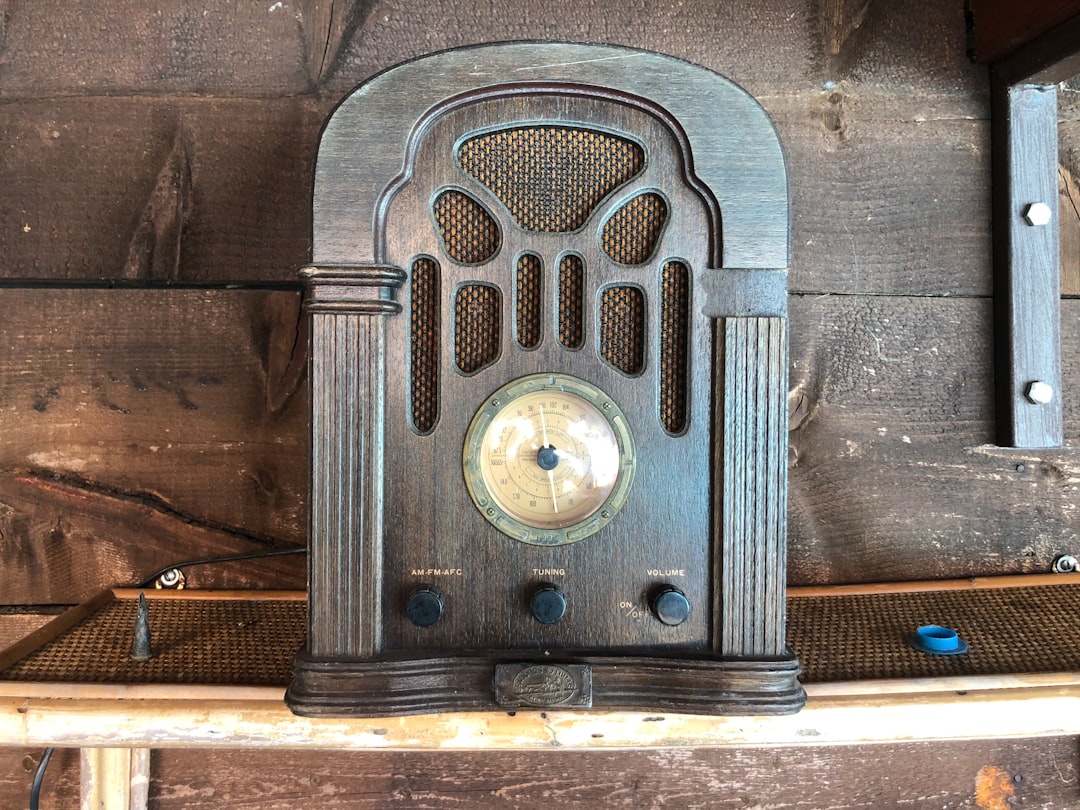 a clock on a wooden box, Old radio in Italian holiday home.
