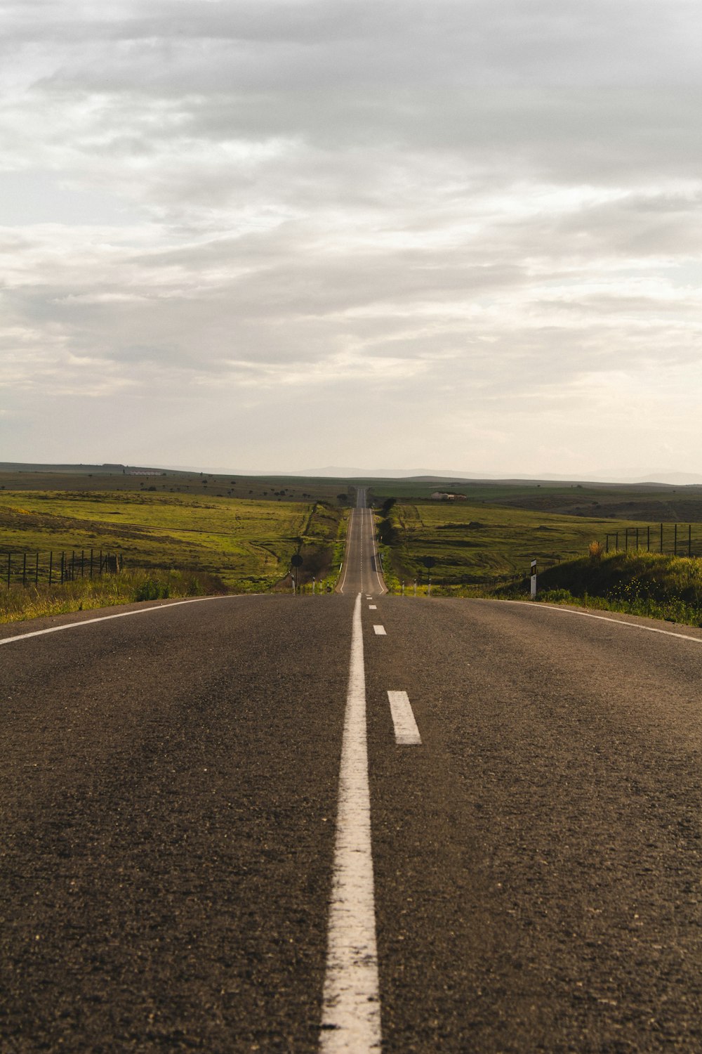 a road with grass on the side