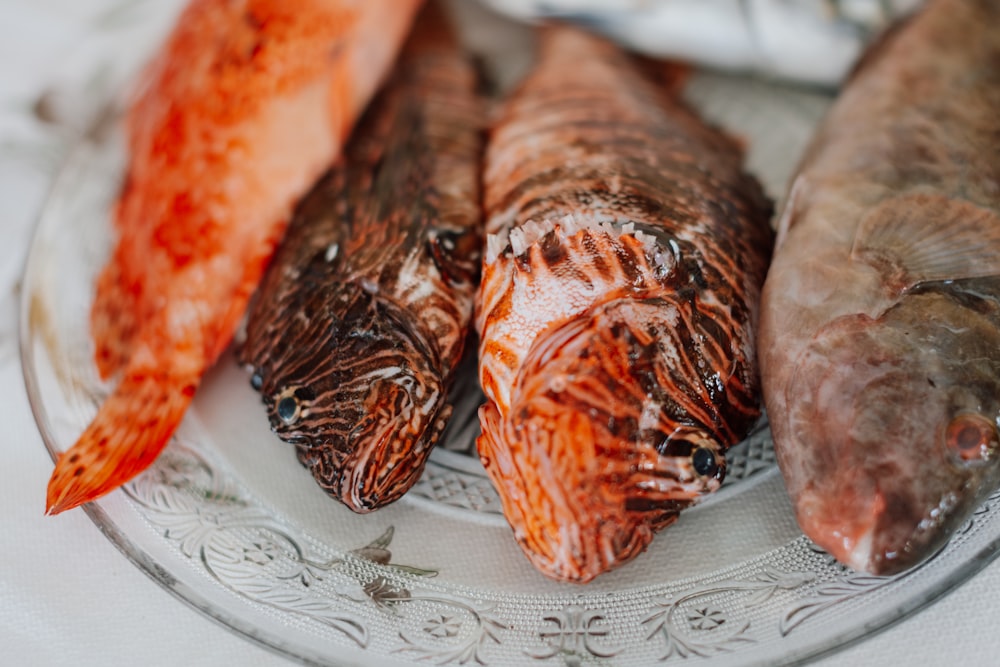 a group of cooked fish on a plate