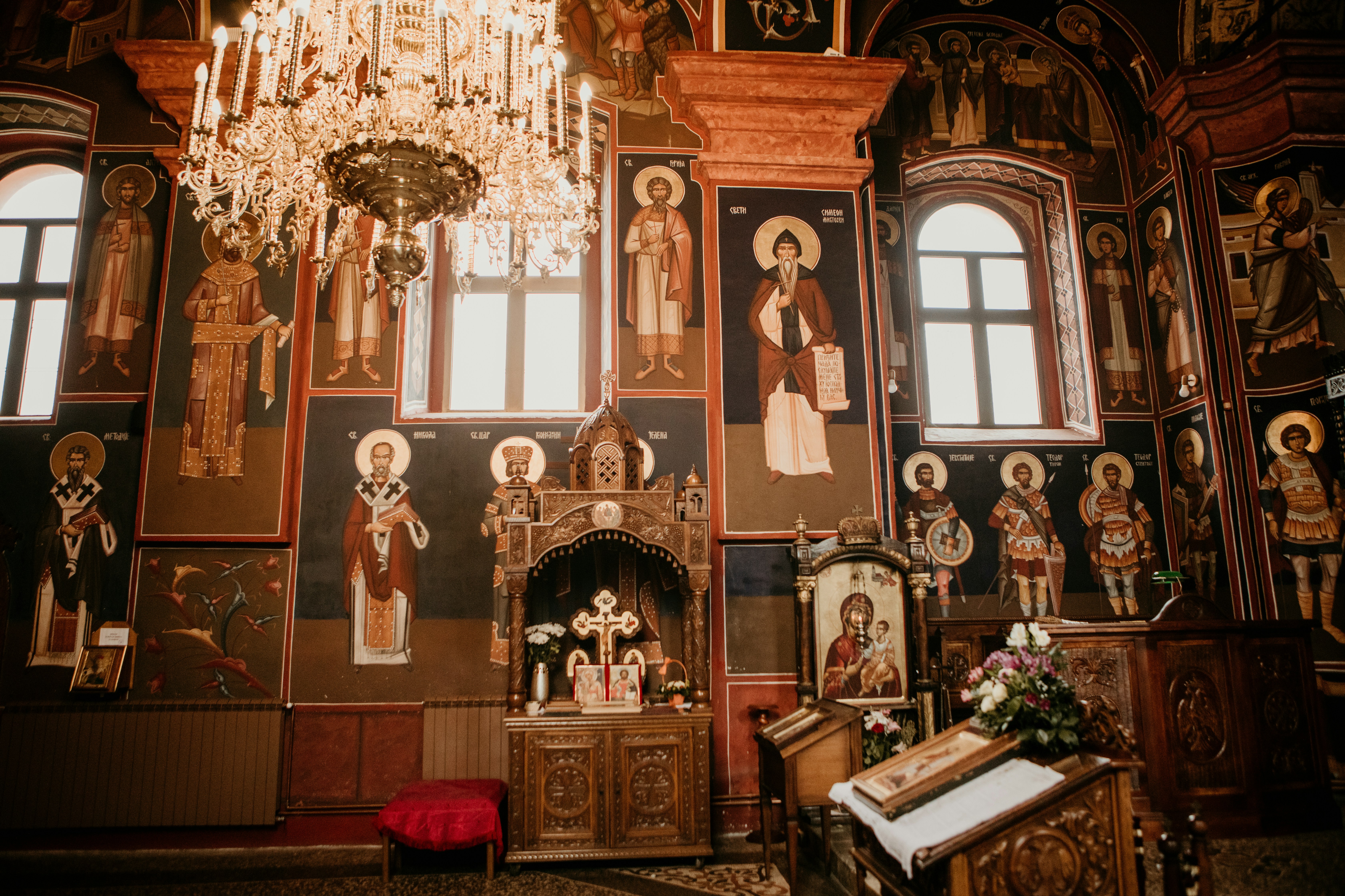 a room with statues and flowers