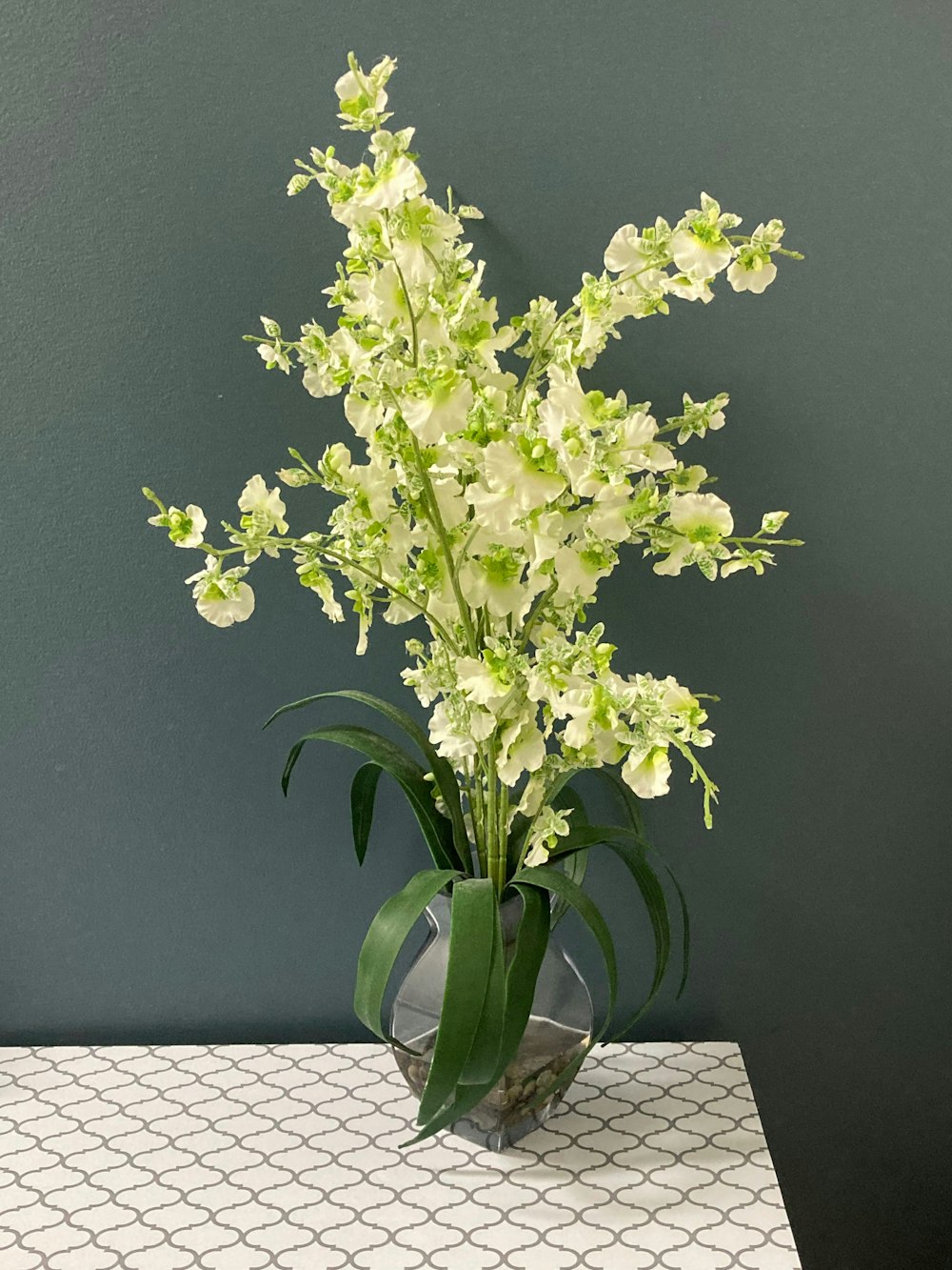 a vase with white flowers