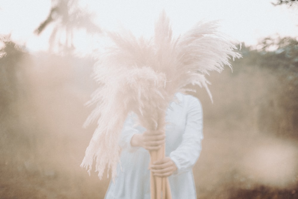 a person holding a white object