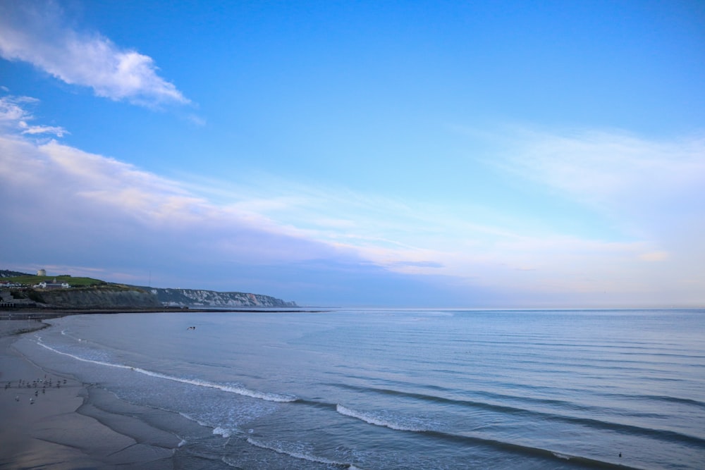 a beach with a body of water