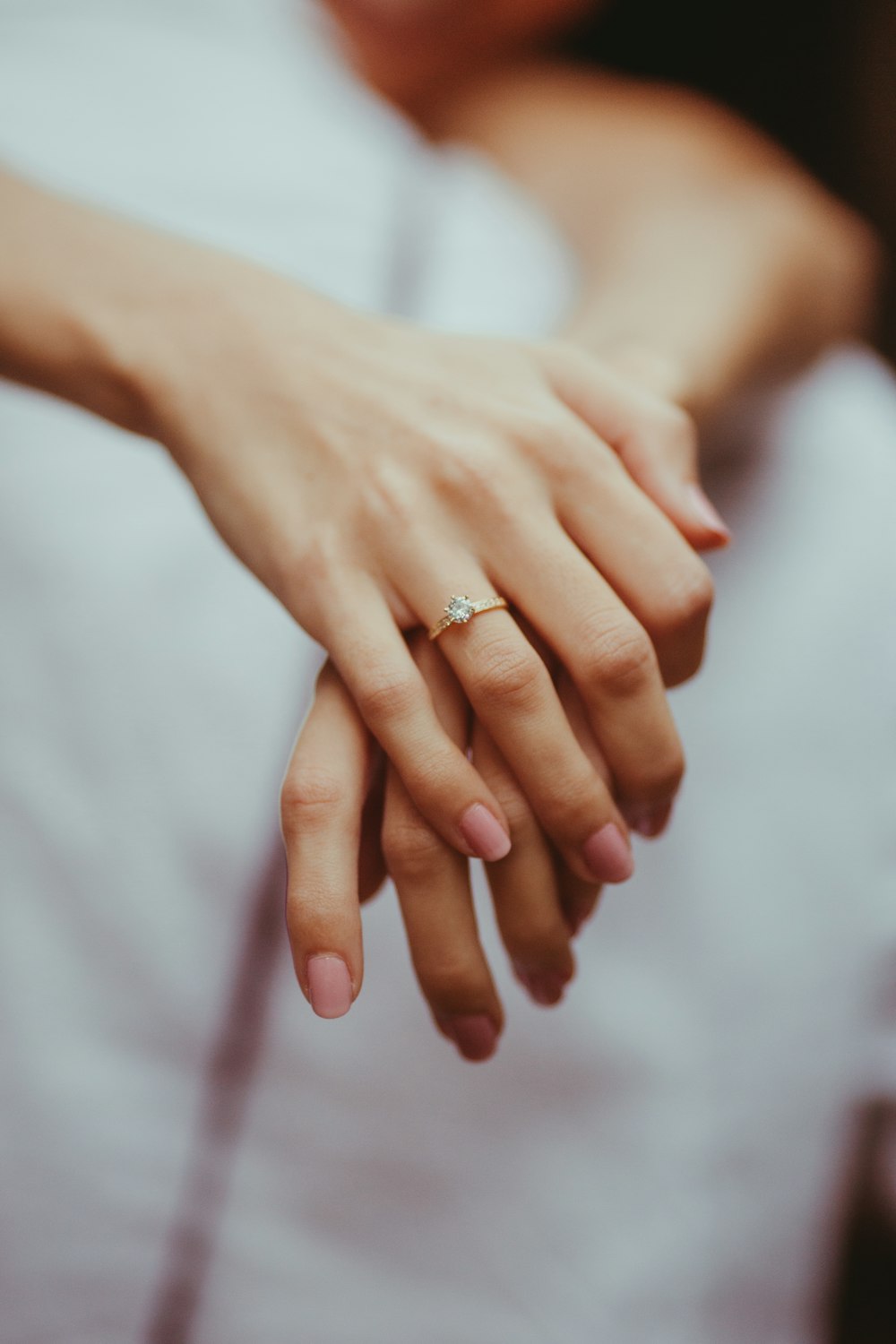 a close-up of hands holding each other