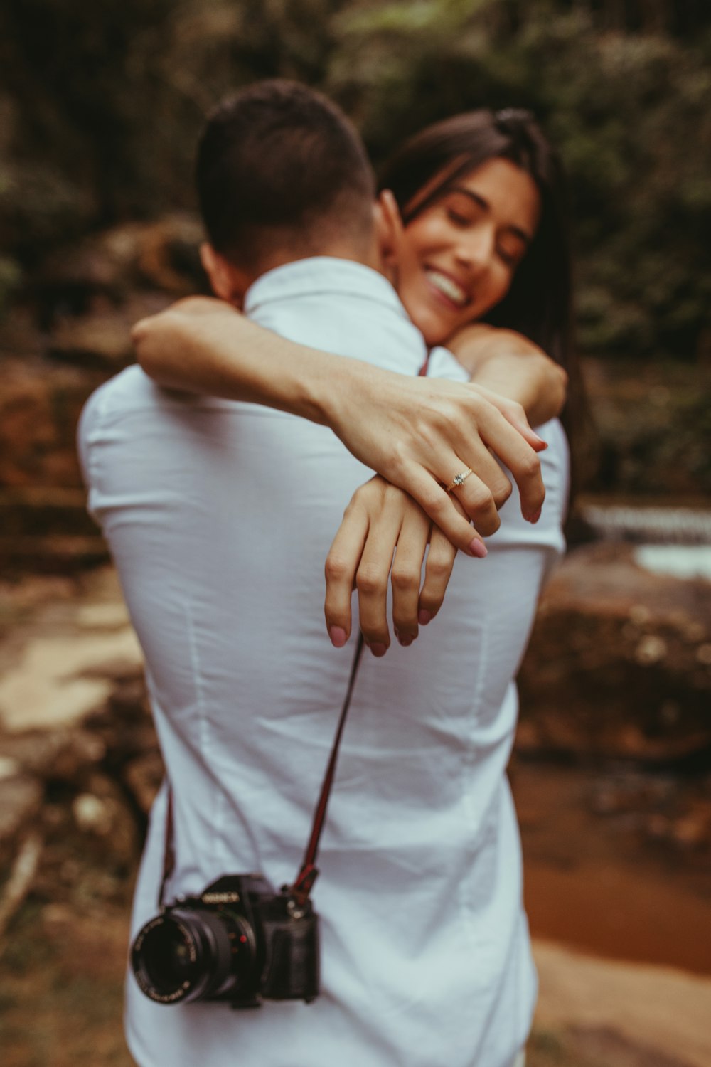 a man carrying a woman