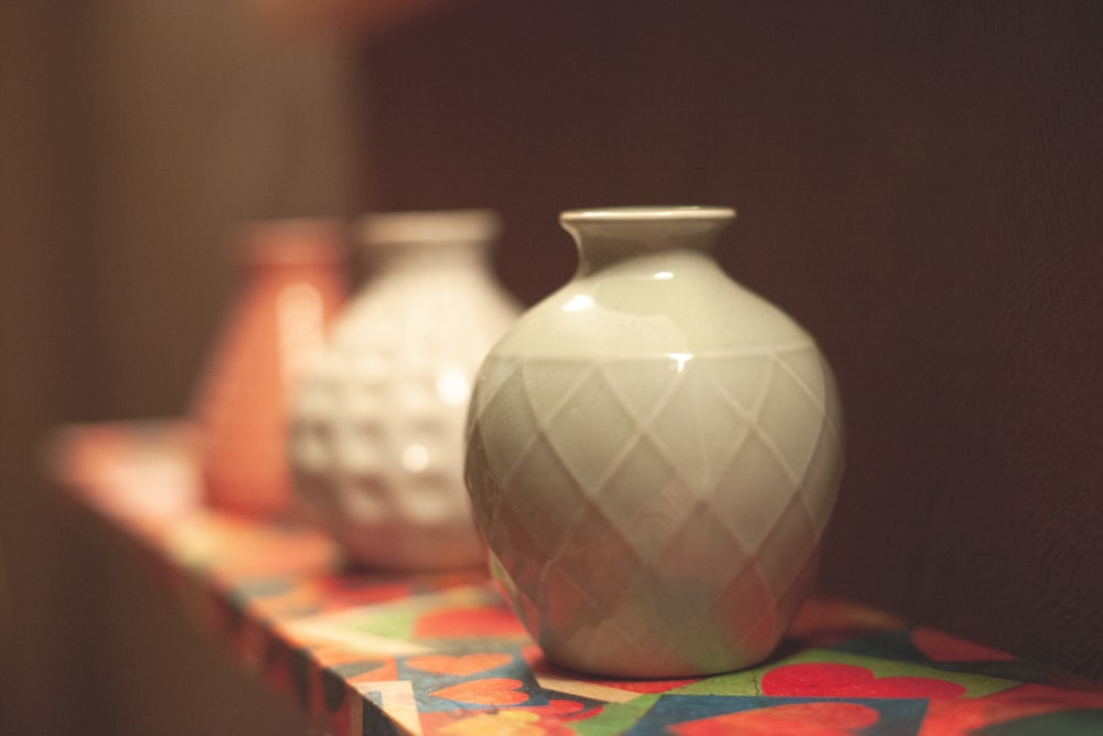 a group of vases on a table