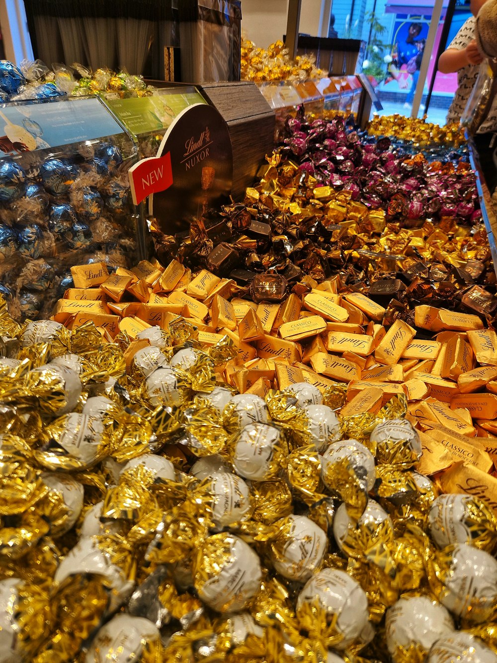 a large display of gold and silver jewelry
